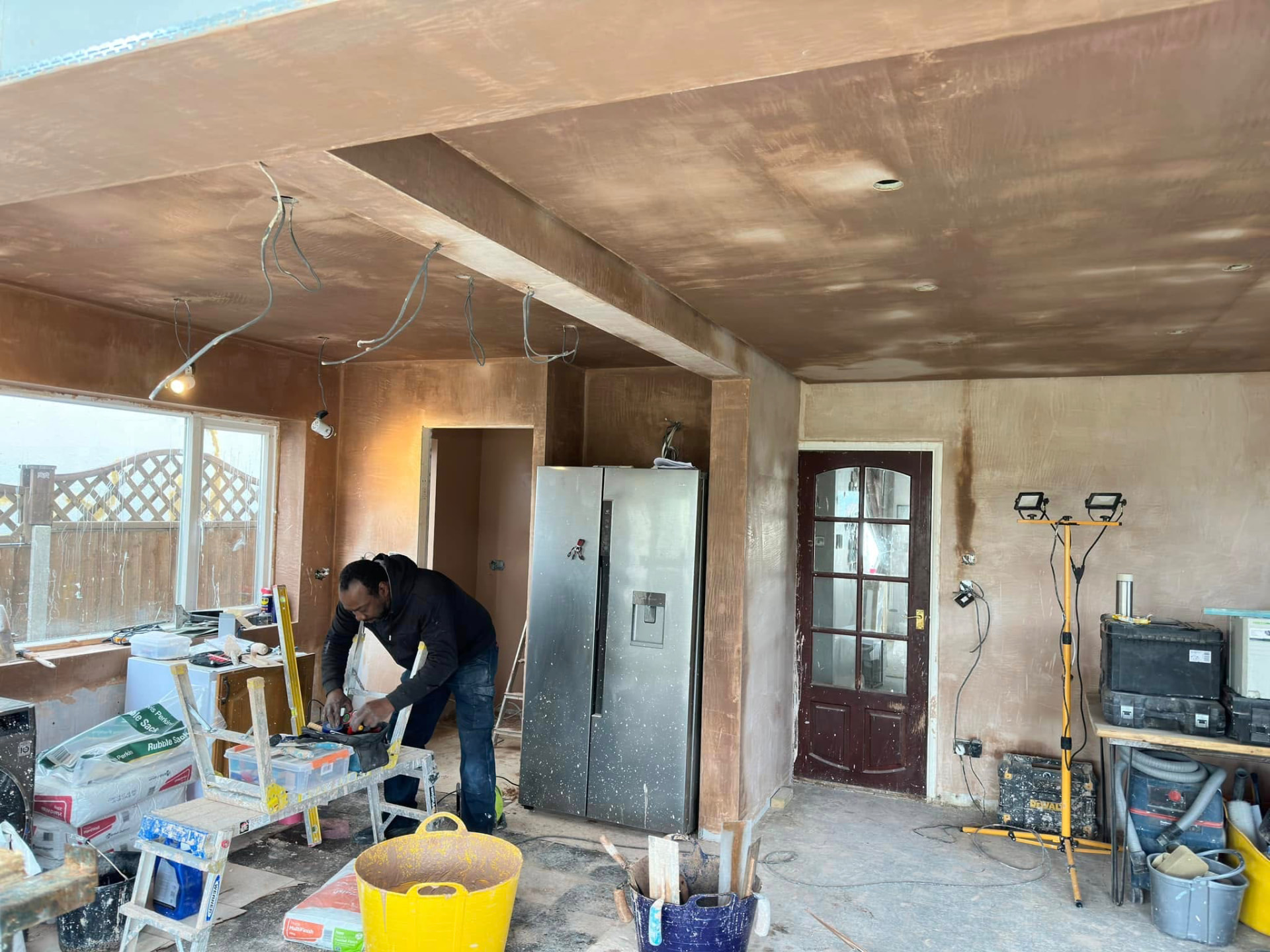 Build in progress with fresh plasterwork and first-fix services